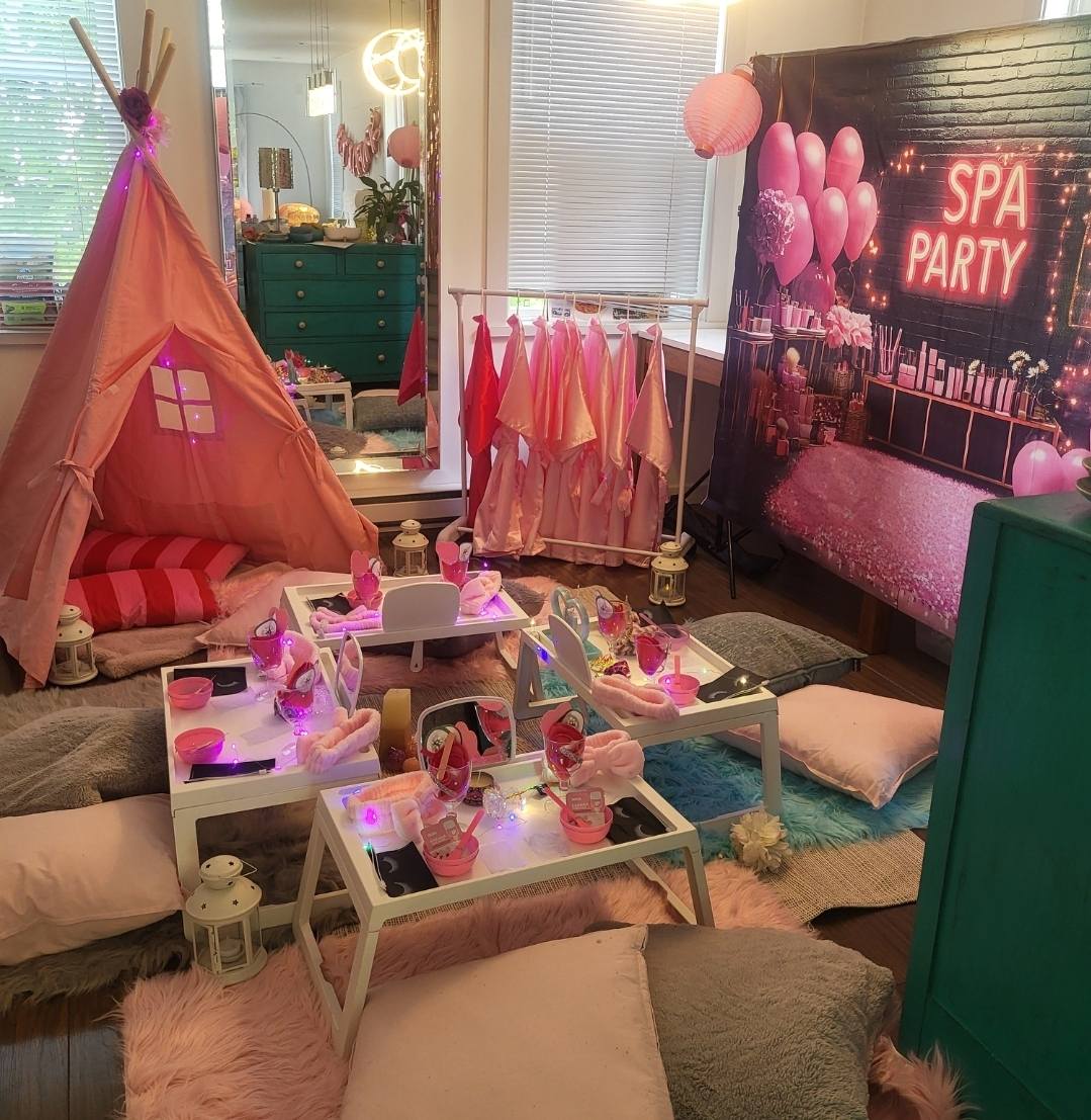 Divas Glam Spa Party setup with teepee, robes rack and SPA PARTY backdrop