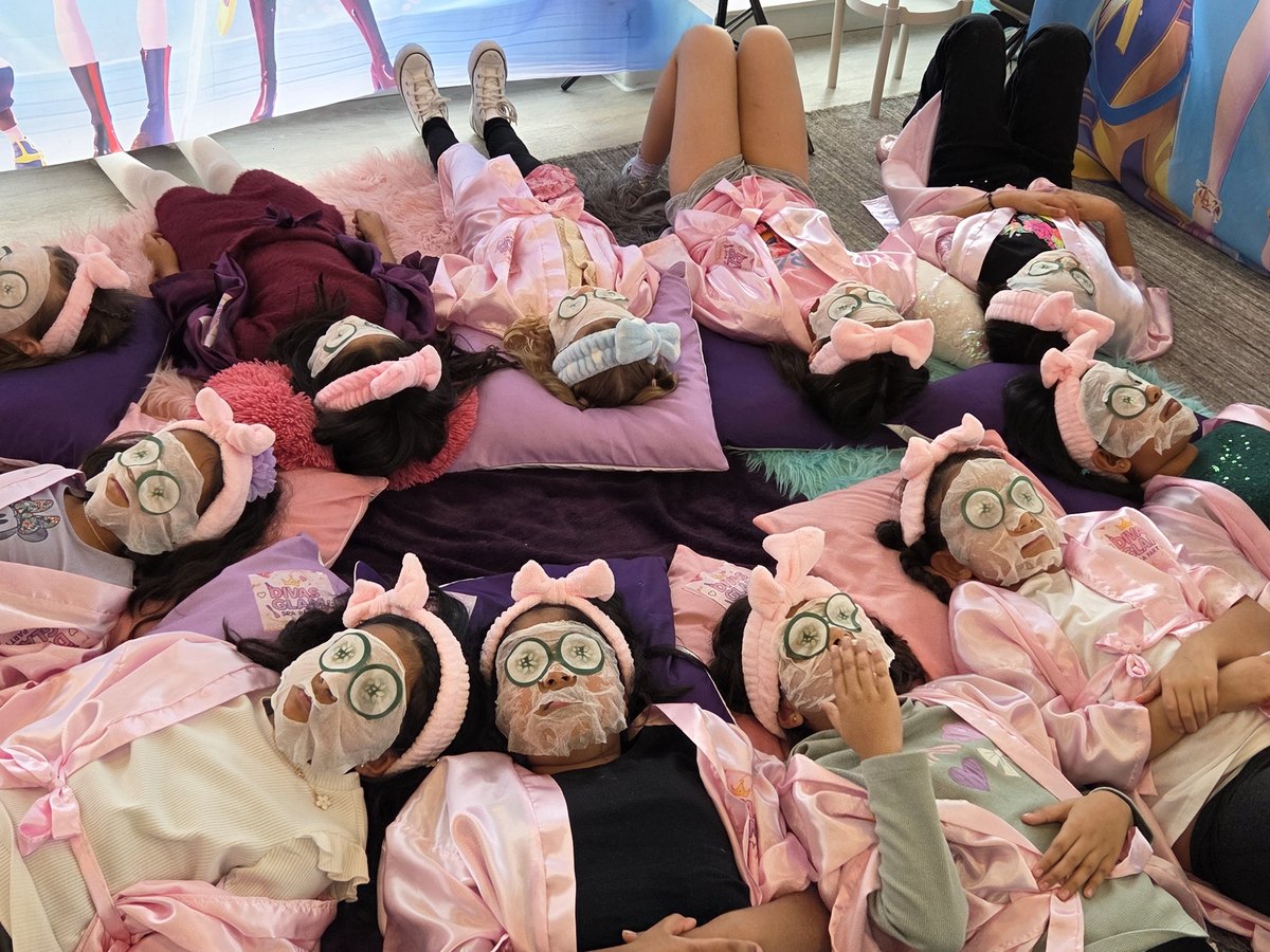 Divas Glam Spa Party — group of girls in pink robes with cucumber spa masks during a real party