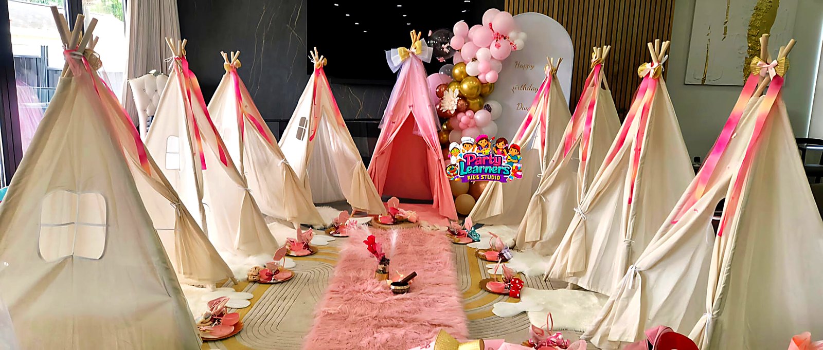 Slumber Party Teepee Setup with multiple cream and pink teepees, cozy bedding and themed backdrop
