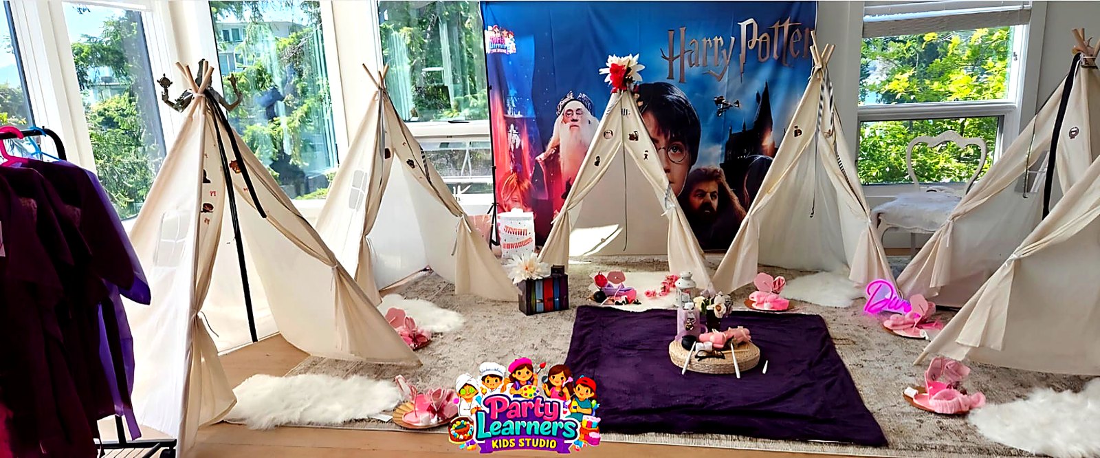 Harry Potter-inspired Slumber Party Teepee Setup with cream teepees and themed backdrop