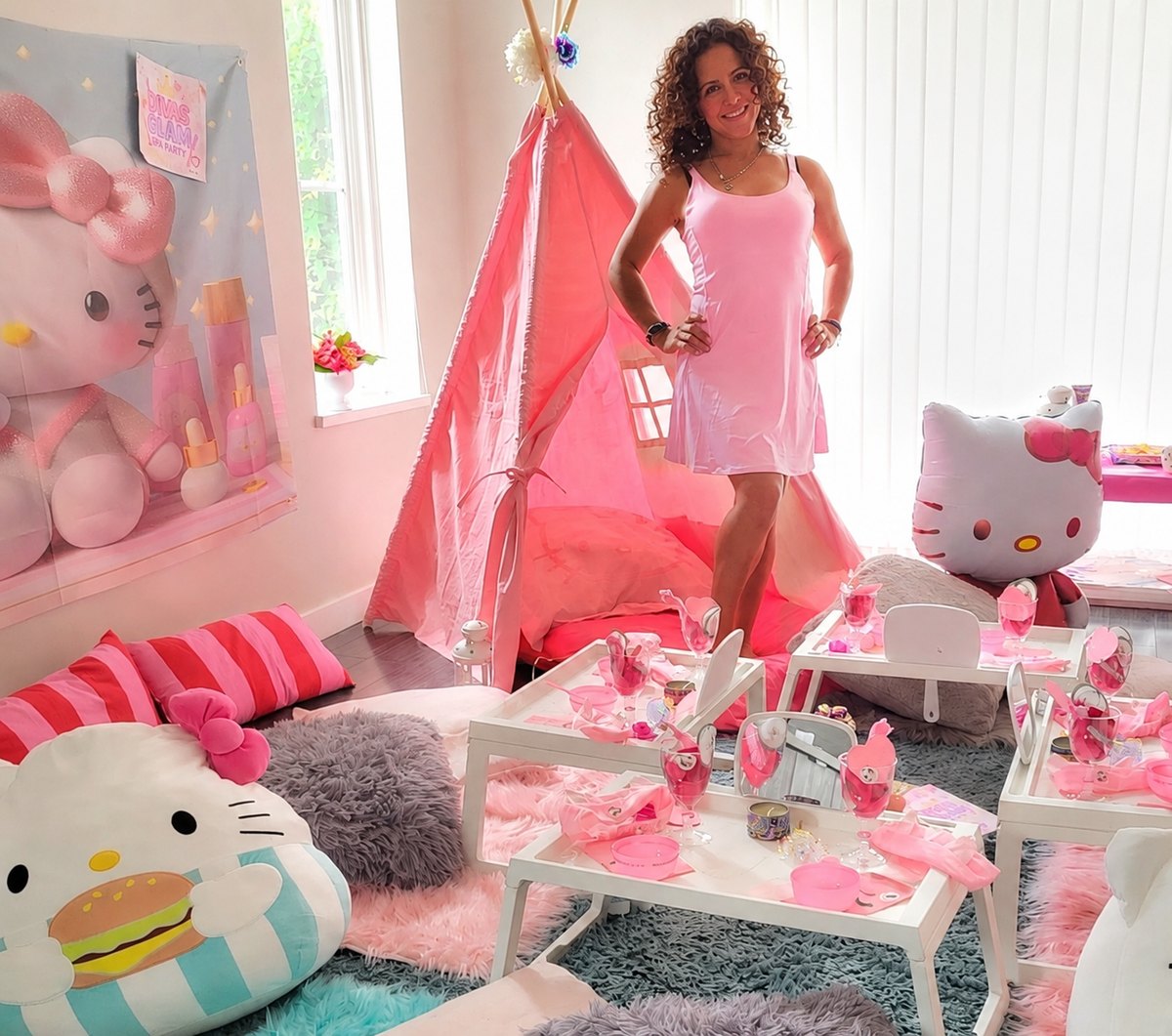 Jenny, founder of Party Learners Kids Studio, standing in a pink themed kids spa party setup.
