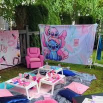 Angel & Stitch themed outdoor Divas Glam Spa Party setup with Stitch backdrop and pink chair